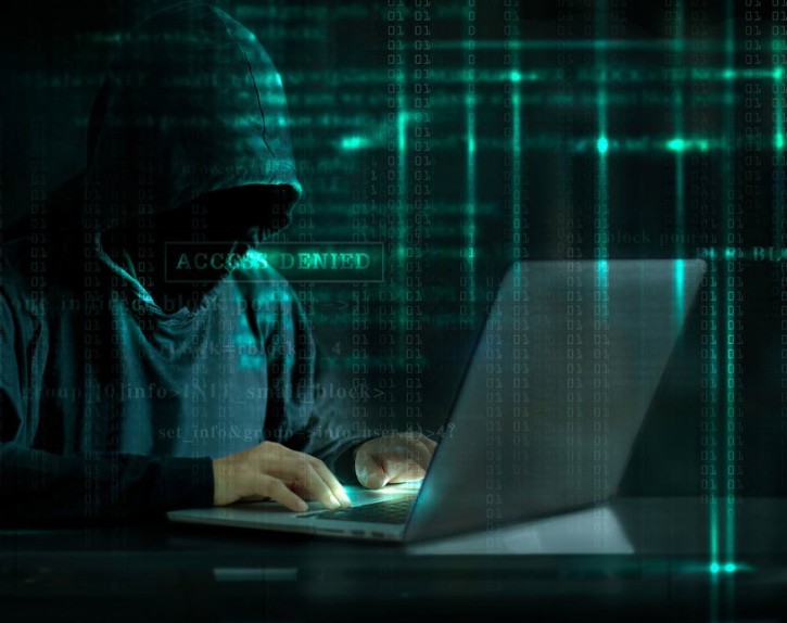 Image of Cyber Hacker installing Ransomware.